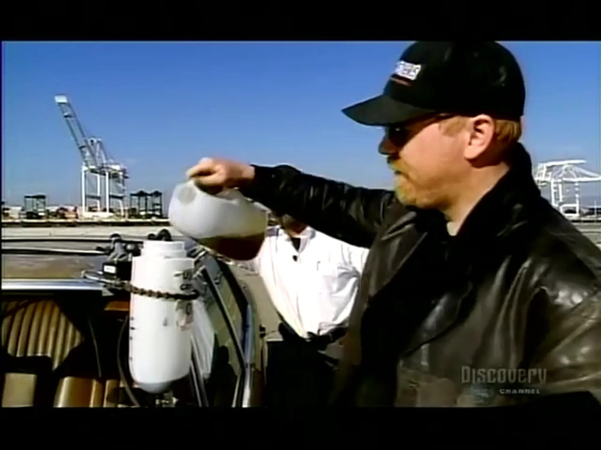 MythBusters — Adam Hyneman pouring vegetable oil into a Mercedes diesel engine at the Port of Los Angeles